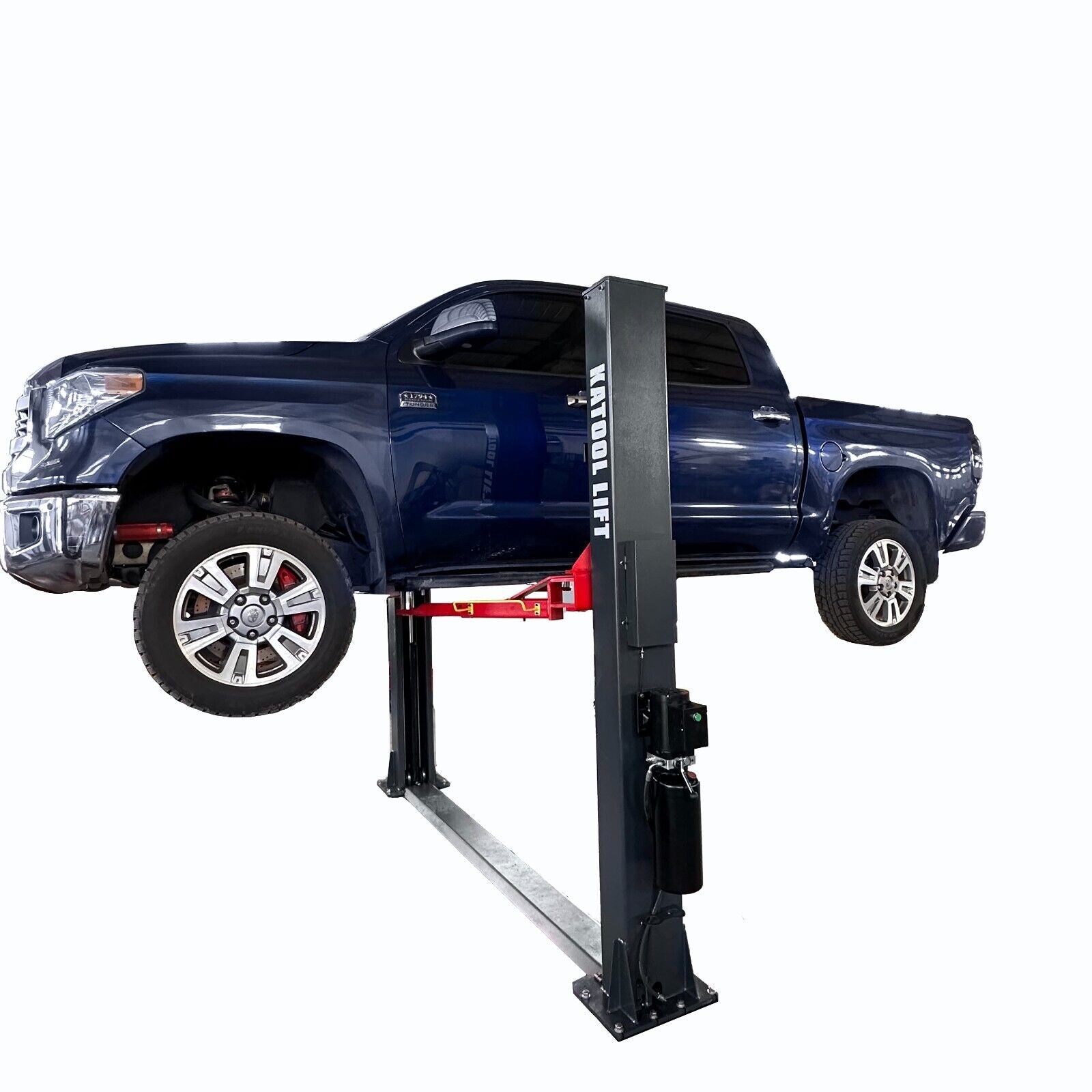 Blue truck on a 12k KATOOL car lift against a white background